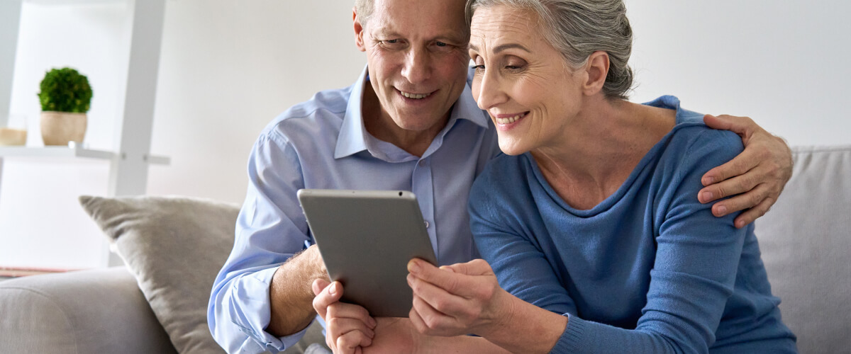 Old Couple checking their tablet